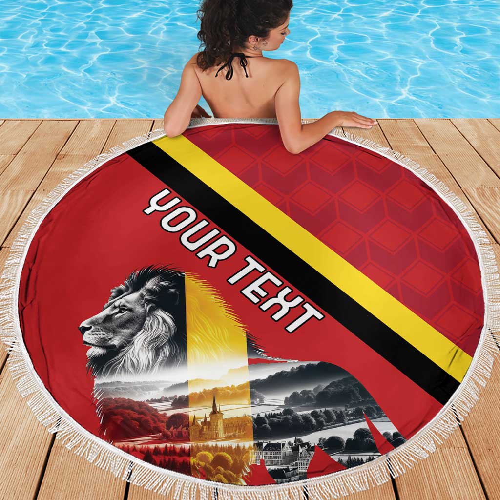Round red beach blanket with Belgium flag stripes and lion graphic, white tassel fringe