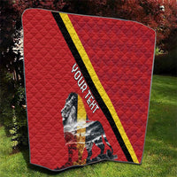 Red quilt blanket folded view with black and yellow diagonal stripe and lion artwork