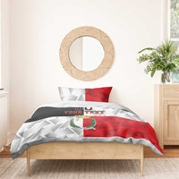 Malta bedding set with red-white geometric design, crest logo, and 'YOUR TEXT' on duvet