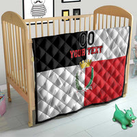 Malta rugby quilt on a crib mattress, black, white, and red panels with crest and custom text