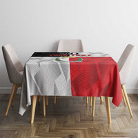 Red and white custom rugby tablecloth on a dining table with matching geometric pattern.