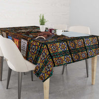 Christian stained-glass tablecloth with saints artwork draped over table edge