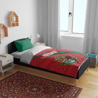 Mexico folk bedding set on bed with red-green comforter and coat of arms, plus green pillows