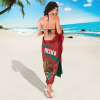 Red and green Mexico crest sarong with MEXICO text, draped on shoulders, back view