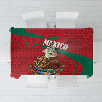 Red tablecloth with green sash, MEXICO text, and coat-of-arms emblem