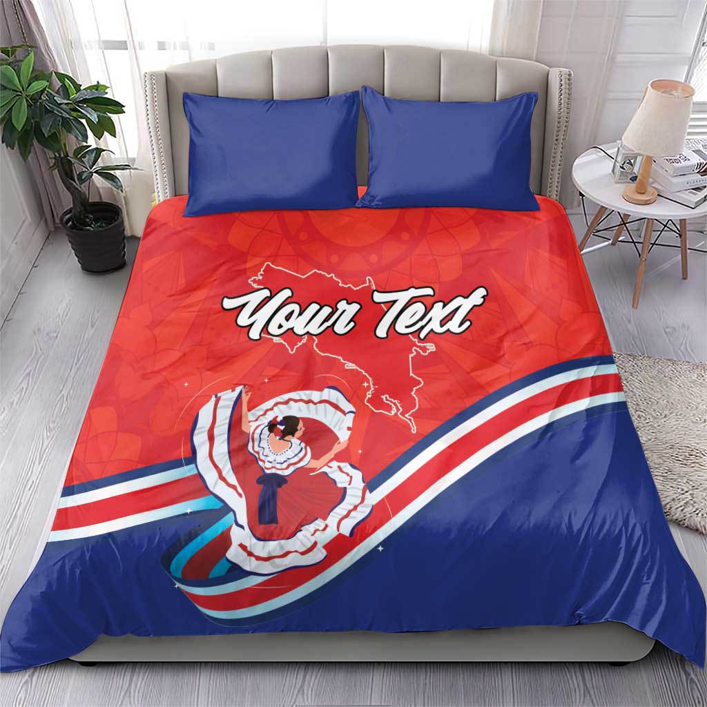 Red and blue duvet and pillow set with two blue pillows; center “Your Text” Costa Rica graphic