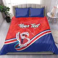 Red and blue duvet and pillow set with two blue pillows; center “Your Text” Costa Rica graphic