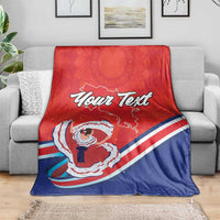 Personalized red and navy blue blanket with “Your Text” and folk dancer pattern
