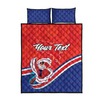 Red and blue quilt bed set with 'Your Text' centered print and two blue pillows