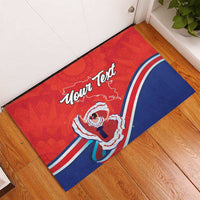 Red rubber doormat with blue stripe, folk dancer graphic, and “Your Text” lettering