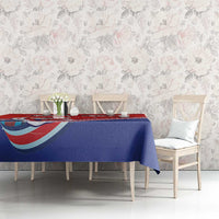 Personalized red and blue tablecloth with folk dancer artwork on dining furniture