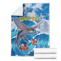 Blue ocean fish blanket with red coral flowers and yellow "YOUR TEXT", folded with stacked white rolls