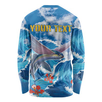 Blue long-sleeve shirt back with ocean waves, flying fish, orange flowers; 'YOUR TEXT'.