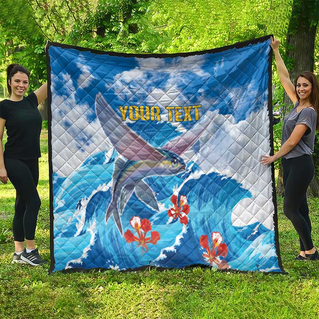Personalized blue quilt with flying fish and red flowers, 'YOUR TEXT' text centered