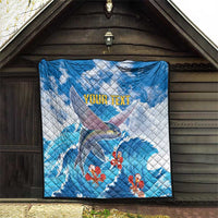 Personalized blue quilt with flying fish, red flowers, and 'YOUR TEXT' on quilted fabric