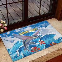 Personalized blue wave fish doormat with custom text and red flowers at doorway