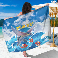 Blue personalized fish-and-wave sarong with hibiscus flowers and text
