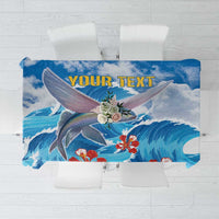 Personalized blue tablecloth with custom text over flying fish and waves design