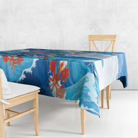 Blue ocean wave tablecloth with flying fish, coral flowers, and draped edge