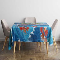 Blue ocean wave tablecloth with colorful fish and coral accents on dining table