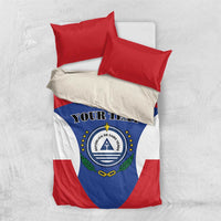 Top-down view of red, white, and blue flag bedding set with “YOUR TEXT” and crest