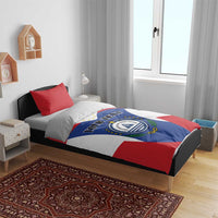 Bedroom view of flag-themed bedding set: red-white stripes, blue crest, “YOUR TEXT”