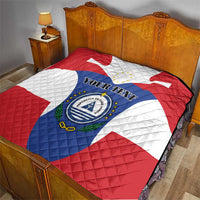 Quilted blanket on bed with Cape Verde flag print, custom text and crest