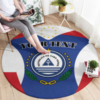 Blue round rug with Cabo Verde crest, red/white side arcs, and 'YOUR TEXT' across