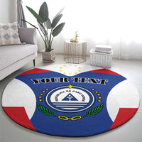 Blue round rug with Cabo Verde crest, stars ring, green laurel, and 'YOUR TEXT' text
