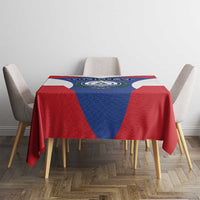 Cape Verde crest tablecloth in red, white, and blue on a table with chairs