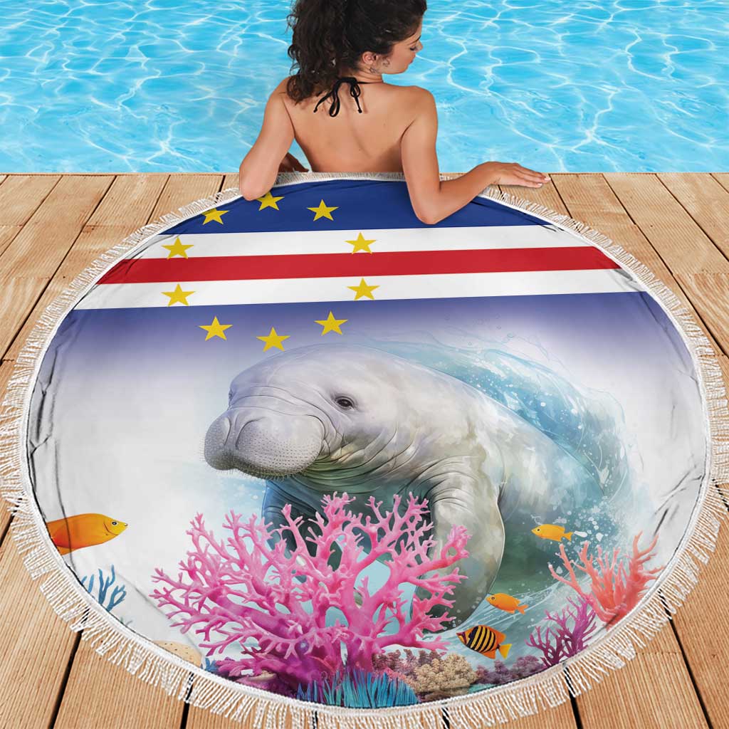Blue round beach blanket with fringe, manatee and coral reef flag design on deck