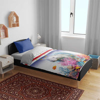 Manatee duvet cover on bed with blue pillows and coral reef star-striped flag pattern