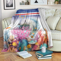 Coral reef manatee blanket with Cape Verde flag style, draped over a chair