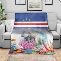 Coral reef manatee blanket with Cape Verde flag style, folded over a sofa