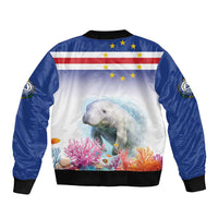 Blue bomber jacket, black ribbed hem and cuffs, manatee reef graphic with flag stars on back