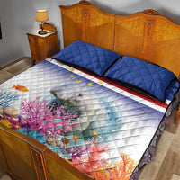 Manatee and coral reef quilt bed set with dark piping, blue pillows, flag stripes