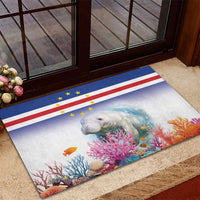 Blue rubber doormat with Cape Verde flag band and manatee among colorful coral