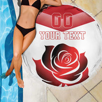 Close-up red rose round beach blanket with white fringe, 'YOUR TEXT' graphic