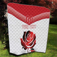 Red and white quilt blanket with “YOUR TEXT” and rose graphic, outdoor view
