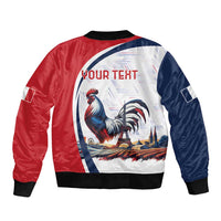 Unisex bomber jacket in red/blue with rooster circle graphic, black ribbed hem and cuffs.