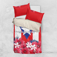Red and white bedding set with Puerto Rico flag center and hibiscus floral bottom, two pillows