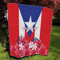 Puerto Rico flag quilt on lawn, red background with blue triangle and white star and blooms