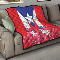 Puerto Rico flag quilt on sofa, red quilt with blue triangle star and white floral print