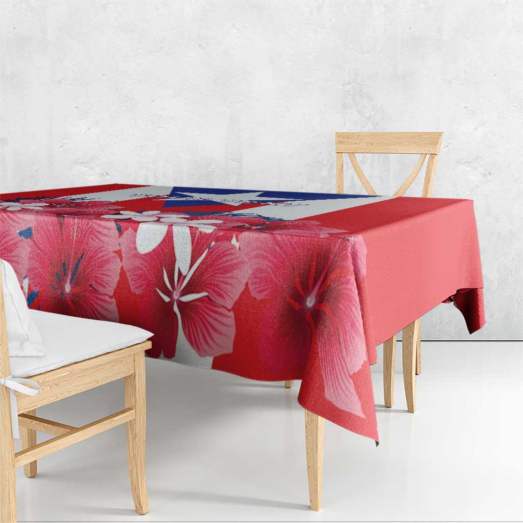 Red hibiscus floral tablecloth with blue-and-white stripe across the top