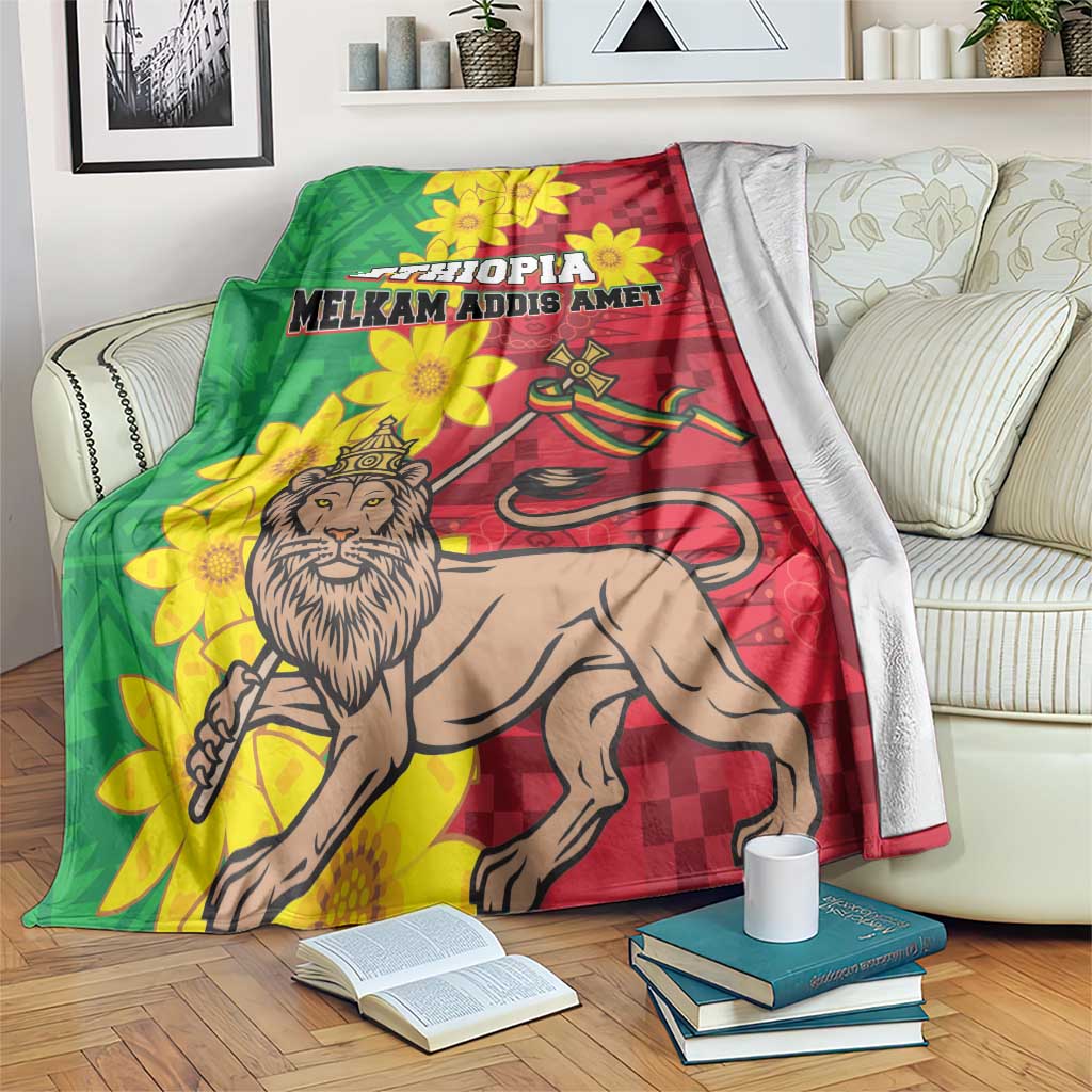 Ethiopia-themed blanket with green and red panels, yellow flowers, lion artwork, bold text