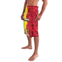 Red printed wrap skirt (lavalava) with floral border and bird artwork, side view
