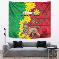 Ethiopian-style wall tapestry with green and red panels, lion and yellow flowers