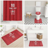 Red bathroom set including shower curtain and coordinating floor mats for toilet area