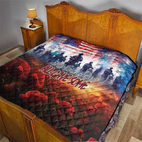 Quilt on a bed with US flag pattern, soldier silhouettes, red poppies, and slogan