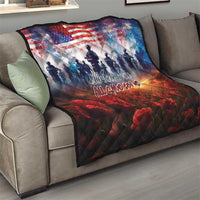 Patriotic quilt on a sofa with US flag design, soldier silhouettes, and red poppies
